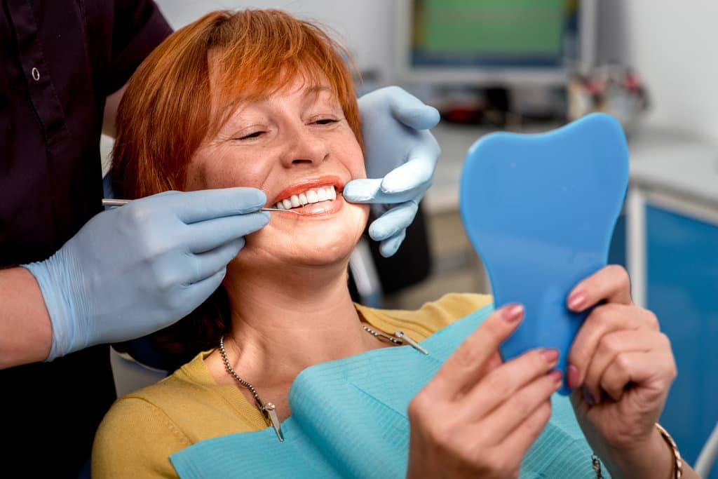 Dentures Vs Implants