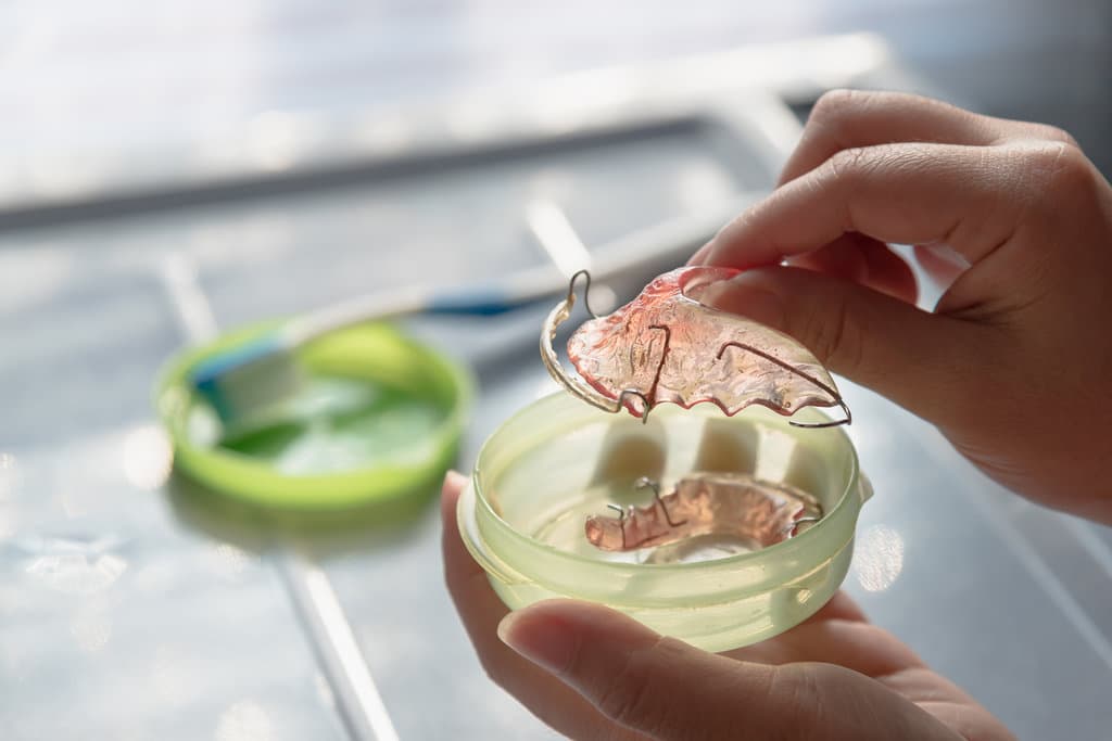 Retainer in woman hand