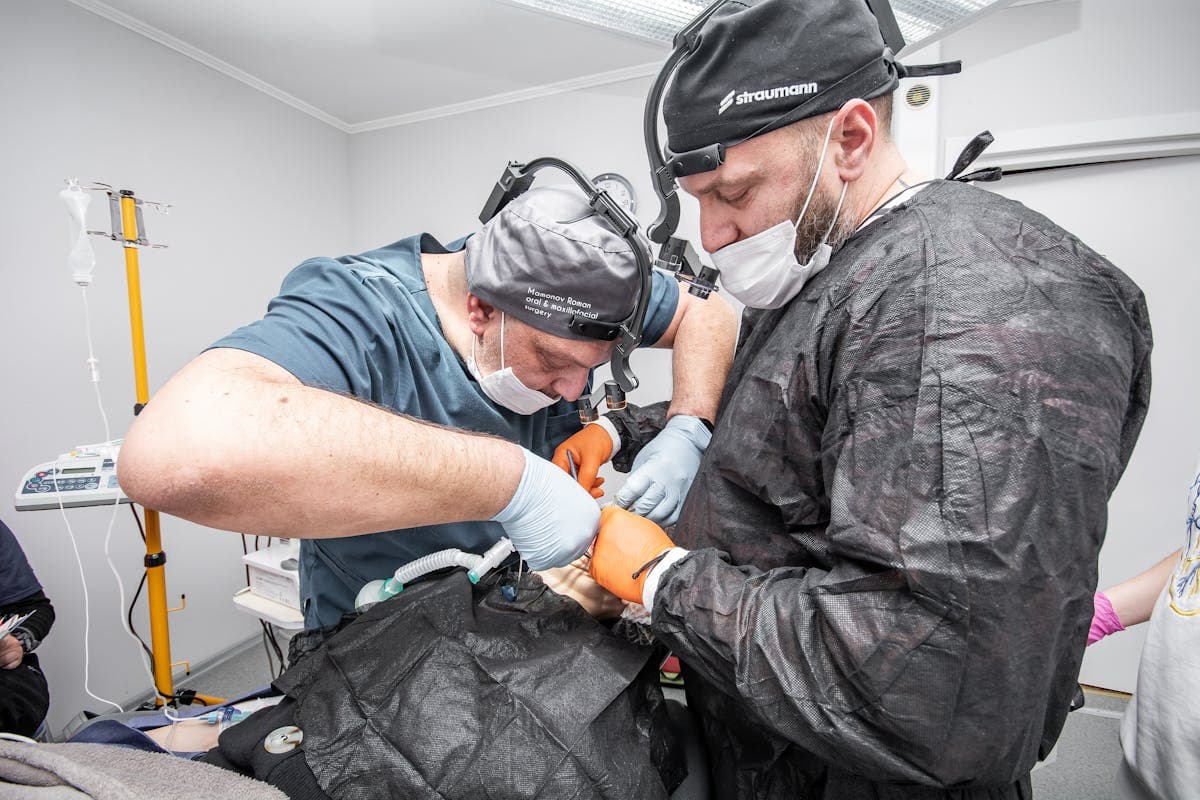 Dentists Treating a Patient in a Dental Clinic.jpg