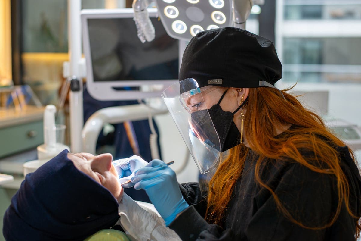 A Dentist Examining a Patient at a Dental Clinic.jpg
