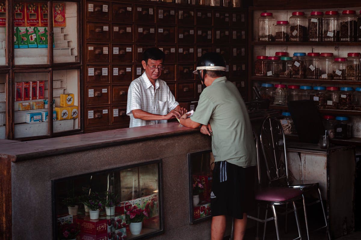 Store Owner Talking with Customer in Asia.jpg