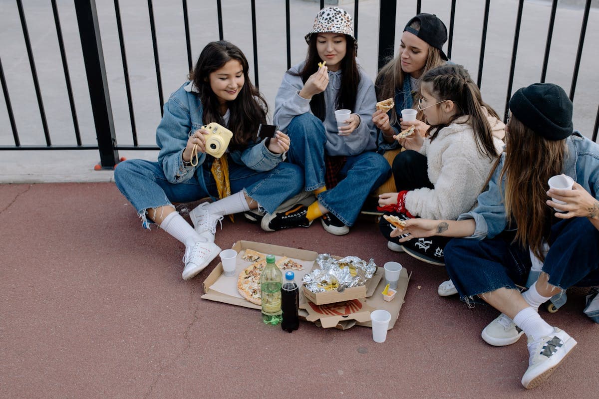 Group of People Sitting on the Concrete Floor.jpg