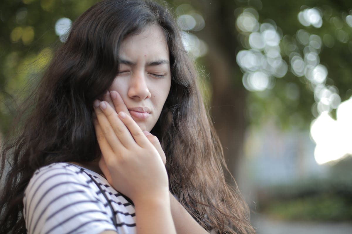 Shallow Focus Photo of Woman in White and Black Stripe Shirt.jpg