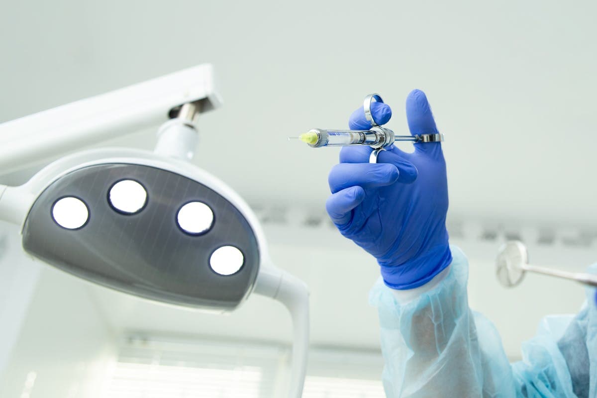 Medical Professional holding a Syringe.jpg