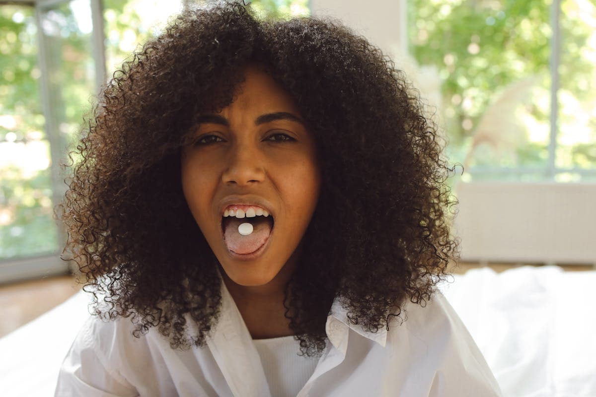Woman with a Tablet on Her Tongue.jpg