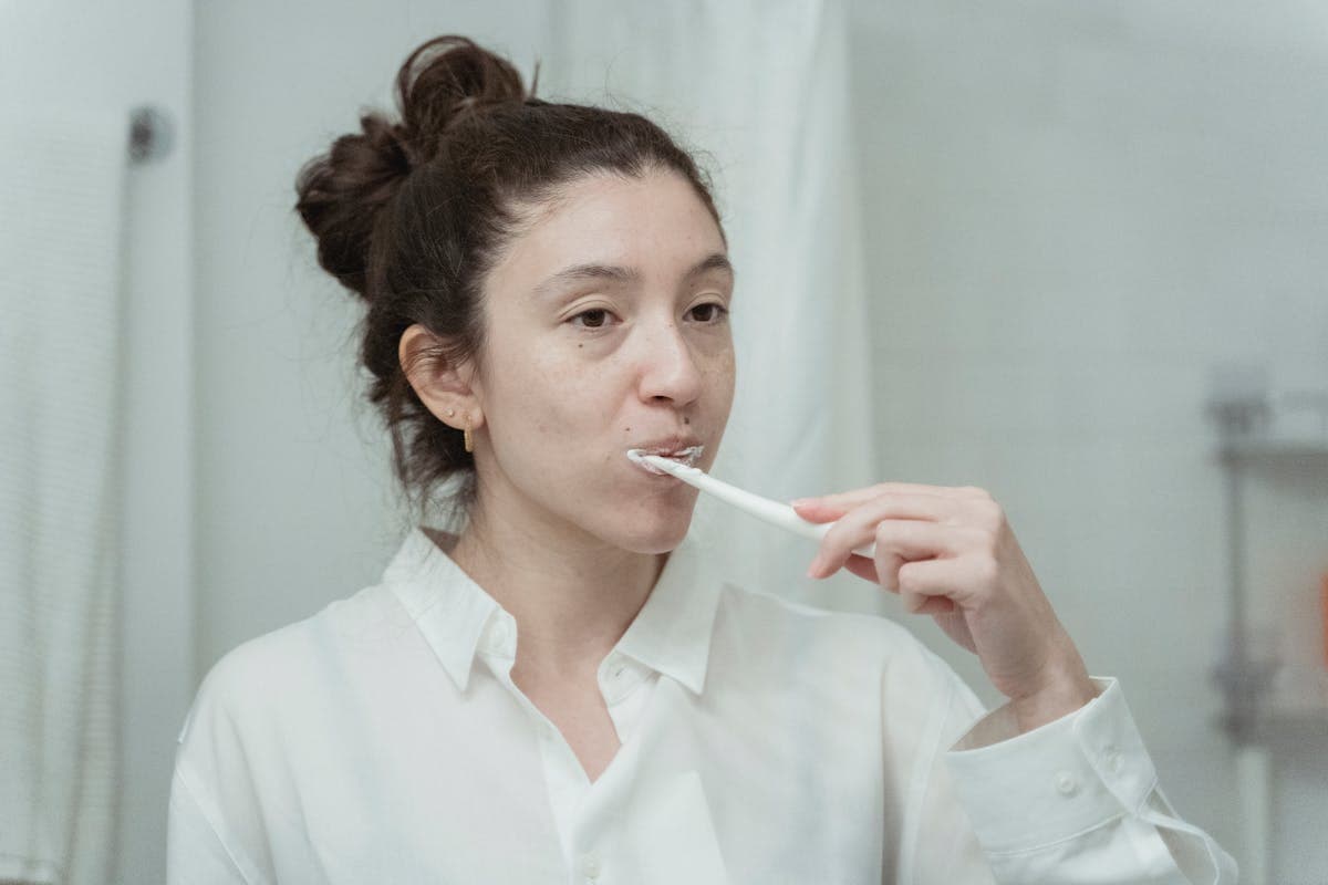 Woman Brushing Her Teeth.jpg