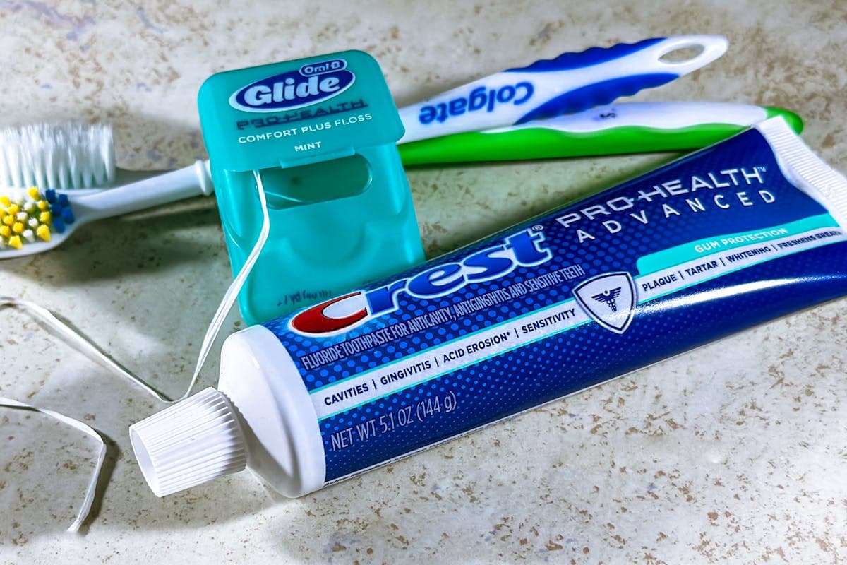 Close up of Dental Floss, Toothpaste and Toothbrushes