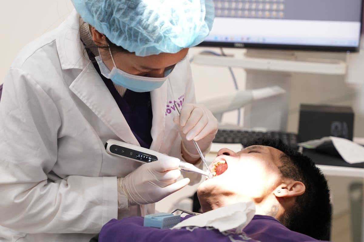 Man Getting a Dental Treatment at the Dentists