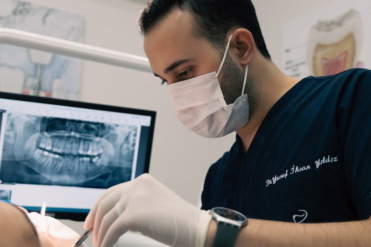 Dentist Treating a Patient in a Dental Clinic