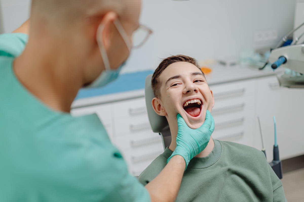 Dentist looking at Patient's Teeth