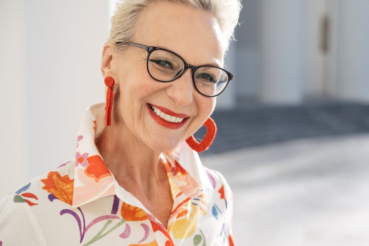 Elderly Woman in Floral Collared Shirt Wearing Black Framed Eyeglasses